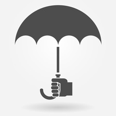 Hand holding umbrella icon concept