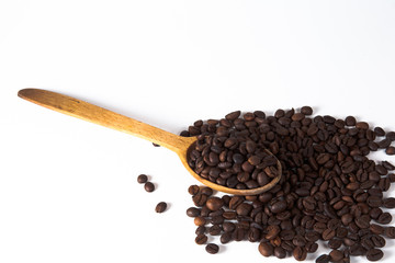 Grain of coffee, beans and spoon
