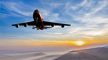 Fototapeta na wymiar Airplane is landing during sunrise, aerial shot