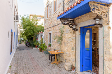 Narrow streets of Bodrum  with cafe table and chairs