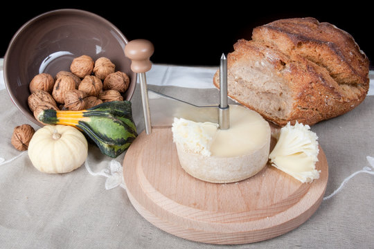 Cheese bread with cheese grater with rustic country bread and nuts