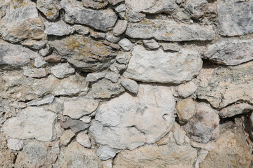 Masonry of an ancient fortress. Stone texture, background.