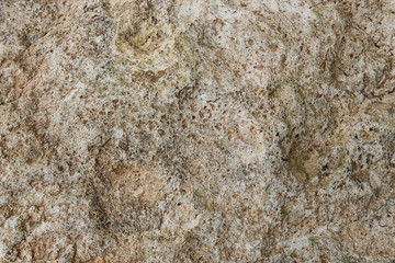 Close-up rough grungy cracked stone texture background. 
