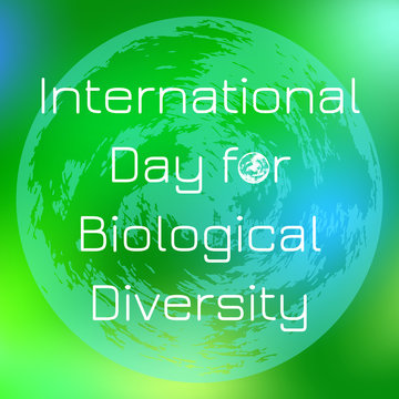 International Day for Biological Diversity. Planet Earth. On a green blurred background
