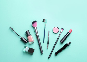 Flat lay composition with decorative cosmetics on color background