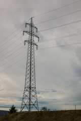 Power pylon on the green field