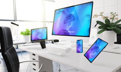devices floating on mid air mockup showing responsive website