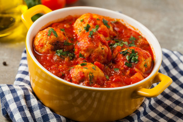Chicken meatballs with tomato sauce. Served with rice.
