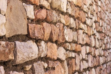 Fototapeta premium Brick wall background and texture (Spello, Umbria, Italy)