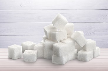 Cubes of sugar on desk