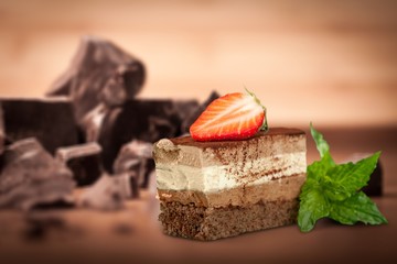 Tasty tiramisu cake on desk