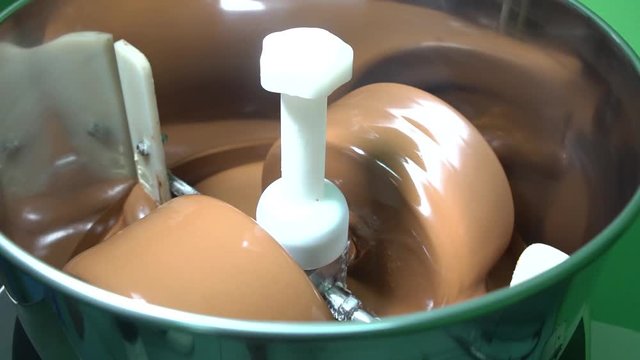 Conching process in chocolate making. Chocolate turning, blending and smoothing