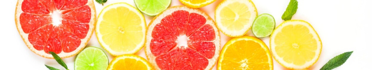 Banner of citrus food pattern on white background - assorted citrus fruits with mint leaves.