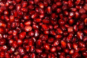 Food background of the fresh ripe pomegranate seeds