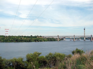View of the bridge over the old channel of the Dnieper from the height of the hill of Khortytsia Island.