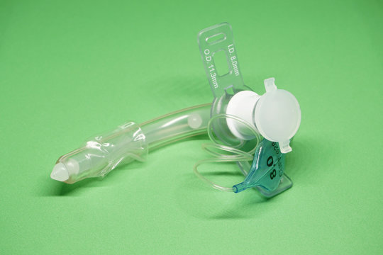 tracheostomy tube on a green background