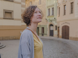 Fototapeta premium A female tourist is walking around the city. Europe. Prague