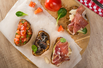 Traditional Italian antipasti, assorted tasty bruschetta