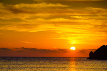 Fototapeta na wymiar Sunrise or sunset over sea surface