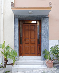 brown wooden door of elegant house