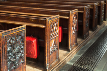 Wooden prayer benches with carving