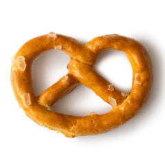 Single traditional salty pretzel snack isolated on white from above.