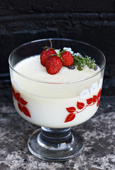 sweet summer dessert with strawberries on a dark background