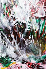 Abstract painting shows white splashes blown by compressed air over colorful background. White areas for text