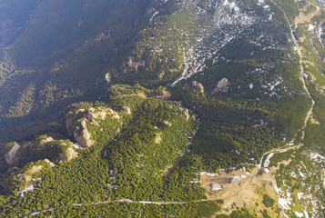 aerial view of Ceahlau mountain with rocky stone and forest landscape. Romania