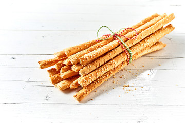 Bunch of grissini against white background