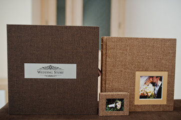 Brown textile wedding photo book or album.