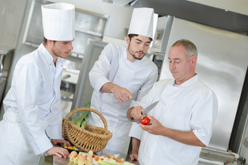 cooks working in a restaurant kitchen