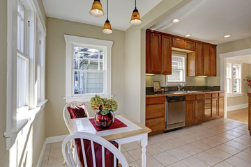 Sun filled breakfast nook opens to the kitchen