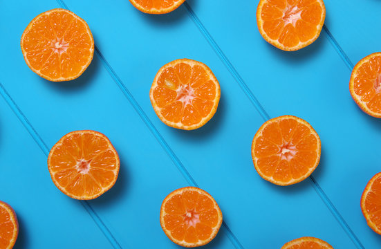 Tangerine on wood table.