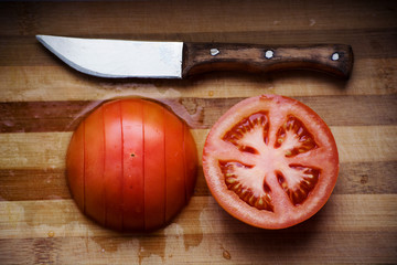 cut tomato with a knife