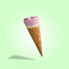 Berry ice cream in a waffle cone. Bright color, summer mood.