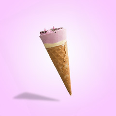 Berry ice cream in a waffle cone. Bright color, summer mood.