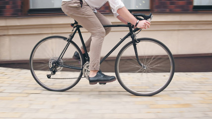 Male feet on vintage black bicycle riding on street © Kyrylo Ryzhov