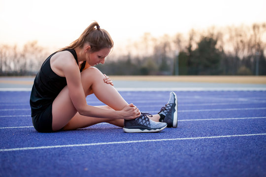 Athlete Woman Has Ankle Injury, Sprained Leg During Running Training