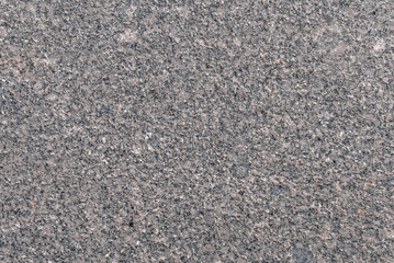 The texture of the street tiles in marble is gray.