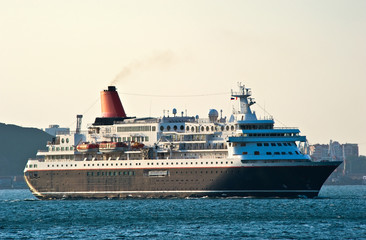 Fototapeta na wymiar Passenger ship is moving on the sea.