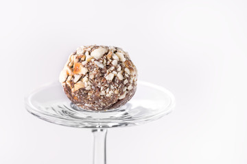 Chocolate Truffles Decorated with Nuts on White Background Beautiful Tasty Homemade Candy Copy Space