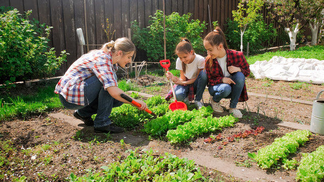 Image of family with children working in garden