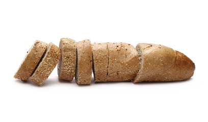 Loaf of whole wheat bread with sesame and slices isolated on white background