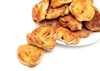 Buns with raisins and jam on a white background