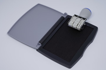 Date stamp with an ink case on a white background