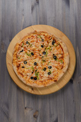 Pizza on wooden board