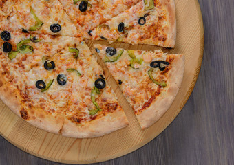 Pizza on wooden board