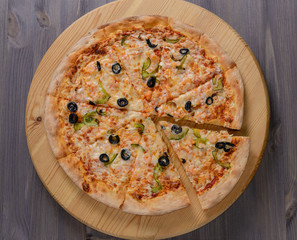 Pizza on wooden board