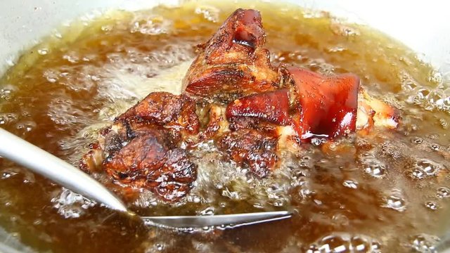Frying pork leg  in pan